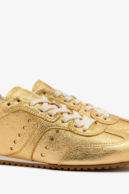 Stella Sneaker In Gold Metallic Leather - Larroude